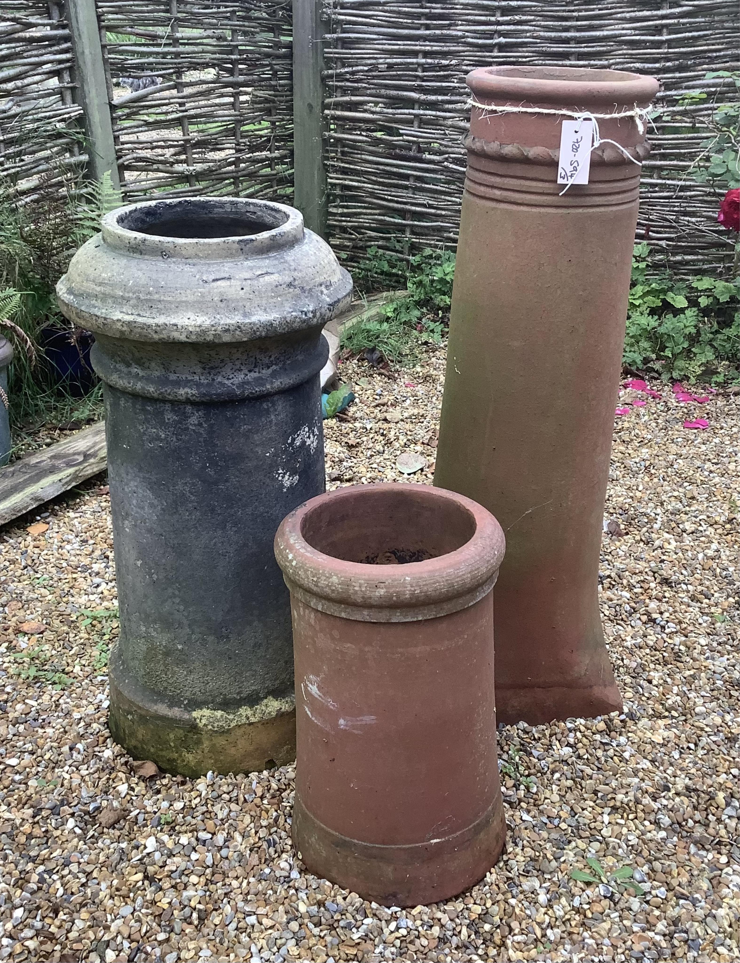 Three assorted terracotta chimney pots, largest height 90cm. Condition - weathered, some small chips otherwise good